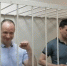 Стоп-кадр из видео Телеграм-канала «БГ Иркутск». Андрей Левченко и Антон Рябикин в зале заседания Кировского районного суда г. Иркутска в день оглашения приговора 29 июля 2022 года - Газета Копейка
